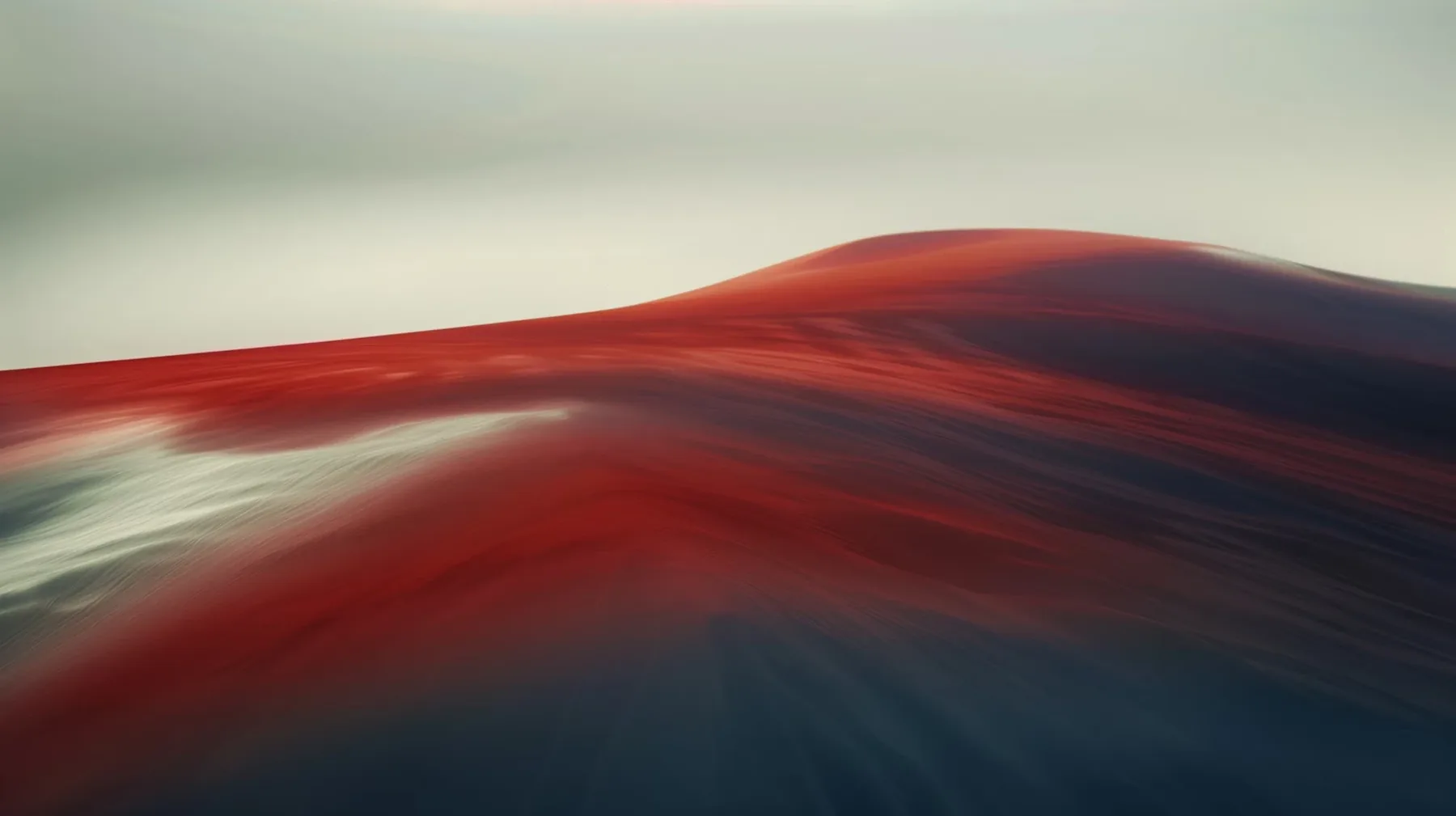 Abstract flowing form in a muted red and grey color palette